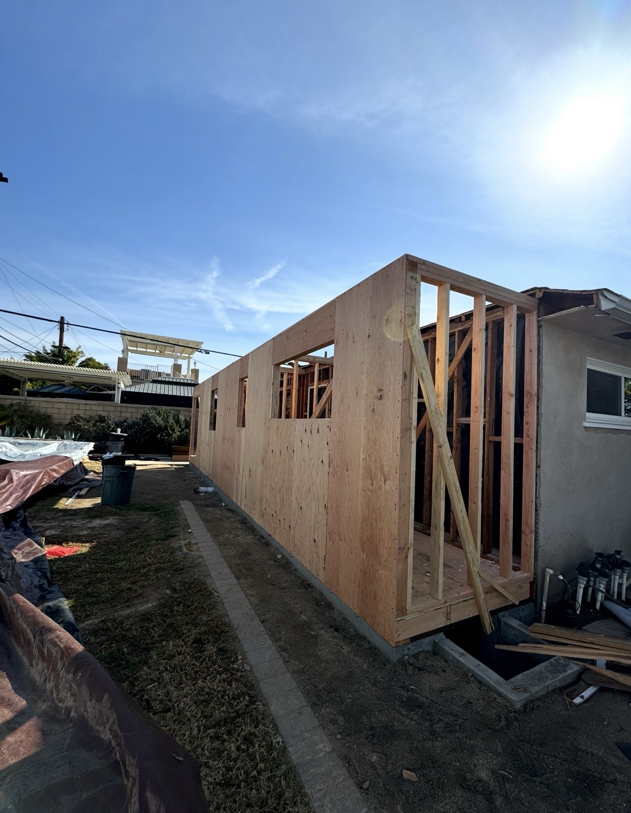 Rear home addition framed along the length of the house
