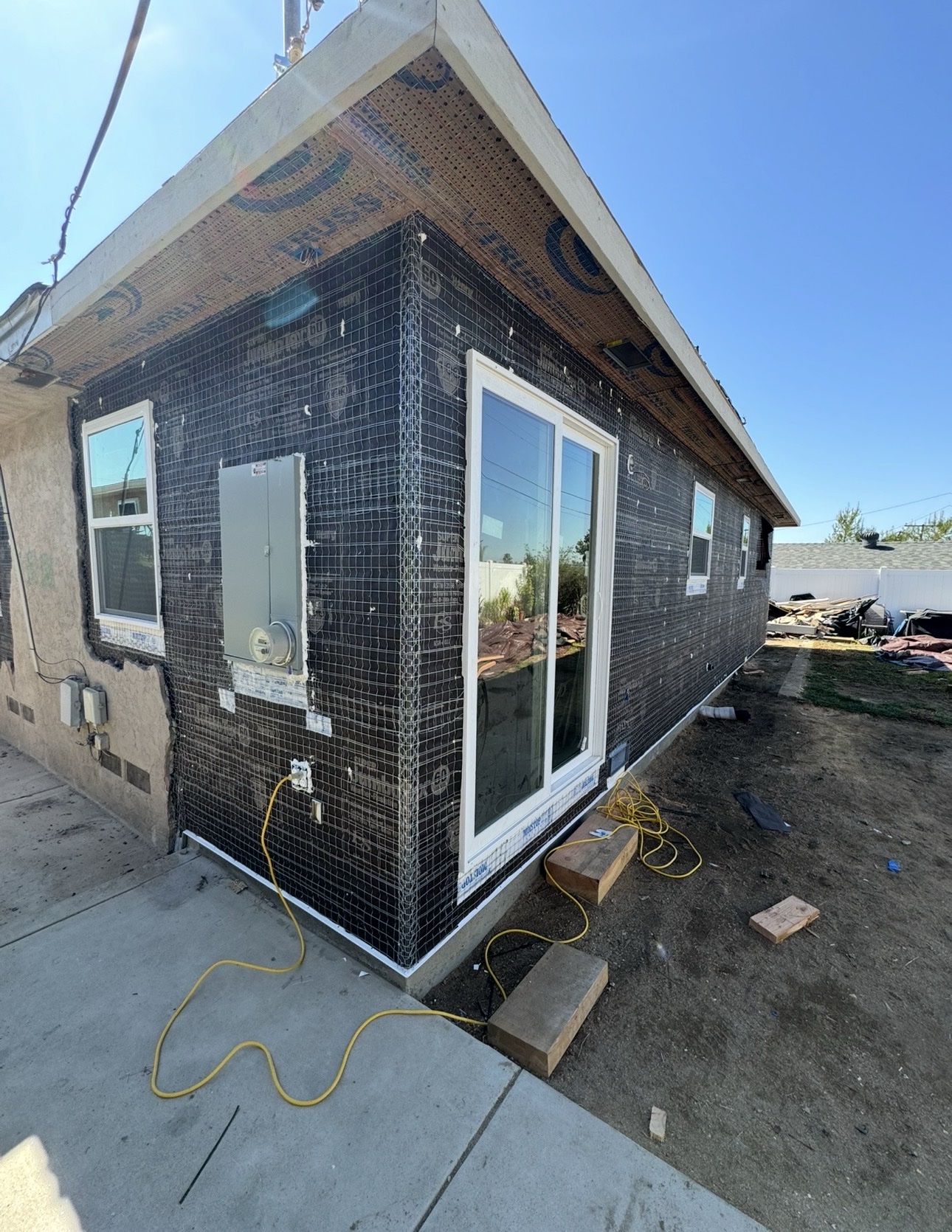 Home addition exterior prepared for its stucco finish