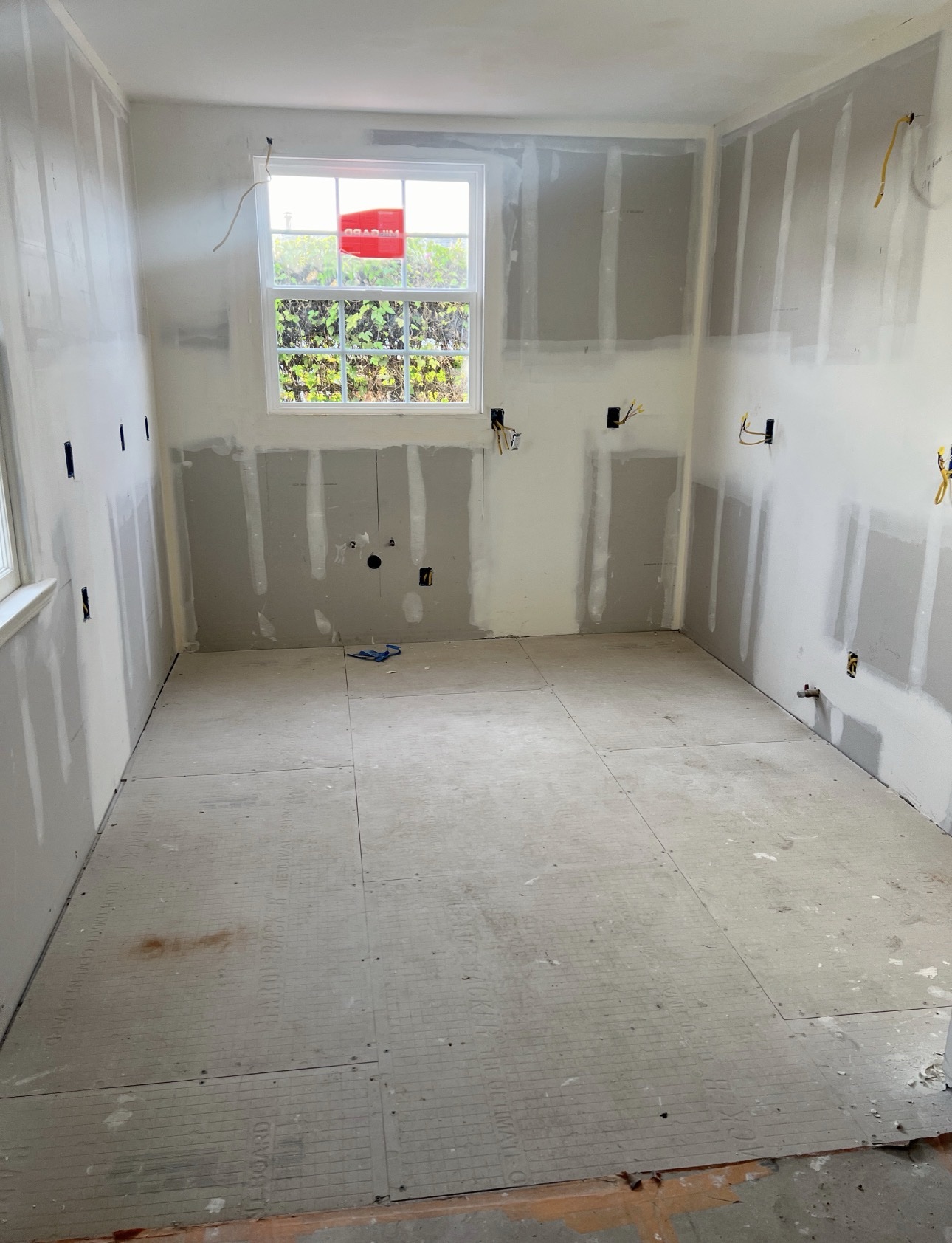 Adams North Park kitchen remodel at the drywall stage with new wallboard and utility rough-ins